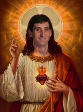Tim rendered in the iconographic style of the Sacred Heart of Jesus, haloed, hand raised in blessing.
